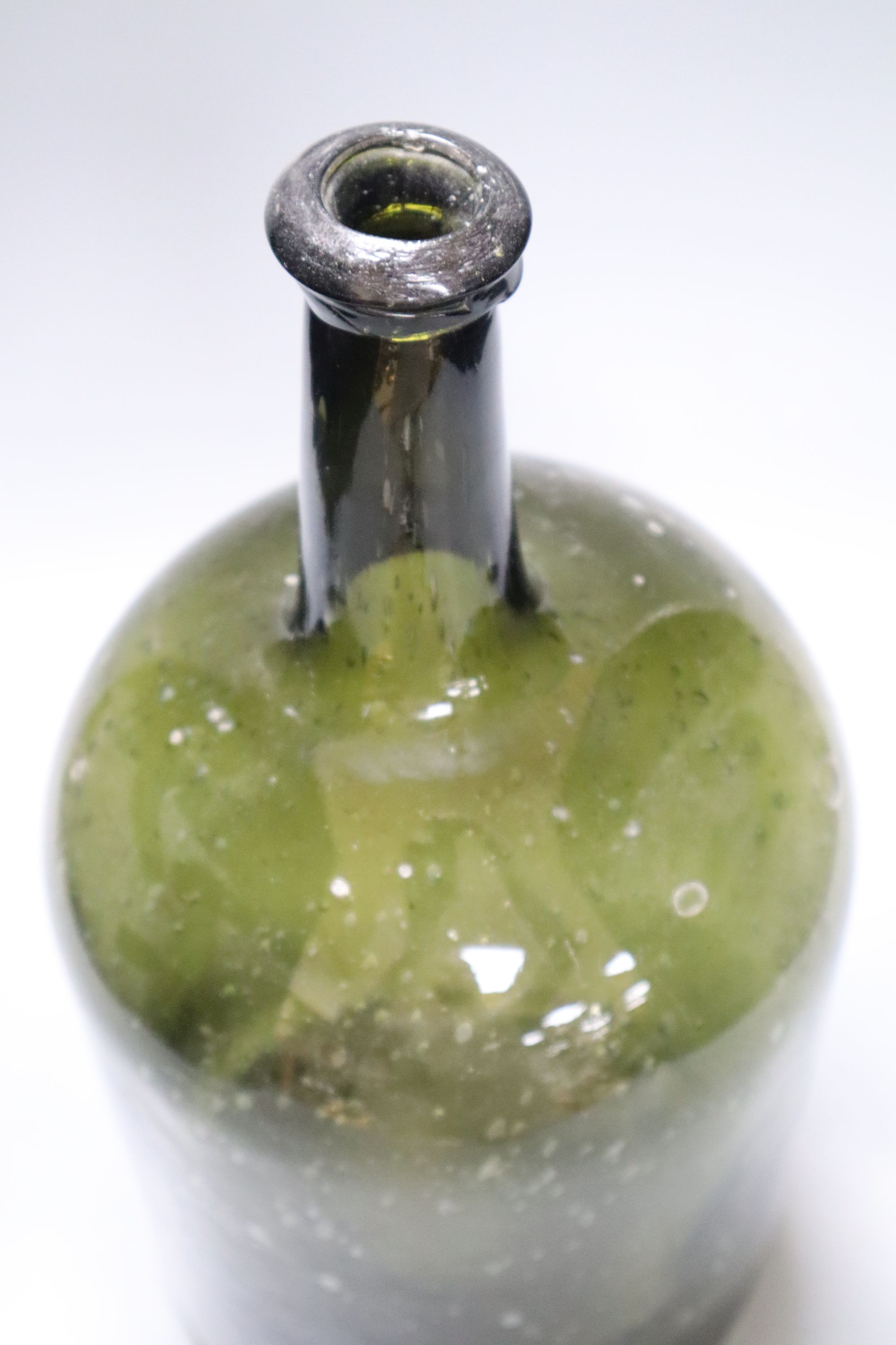 A 19th century green glass demijohn bottle, 34cm